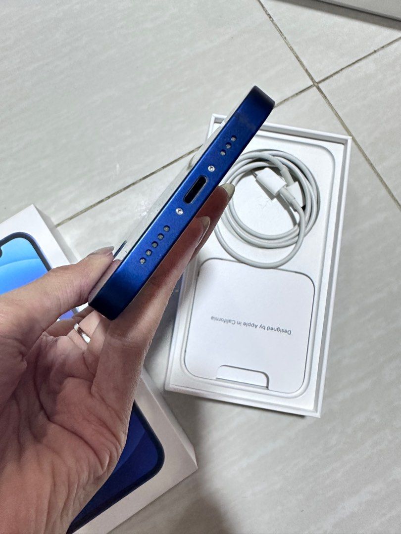 IPhone (Category: iPhone 12 Series) located in Singapore. Submitted by Queenie.KTM (Listing ID 1225851850, Image 3). Description: Used iPhone 12 for sale $580 Blue colour 128gb / BH 88% Phone in good condition Well used no issues Come with cable with box Interested pm.