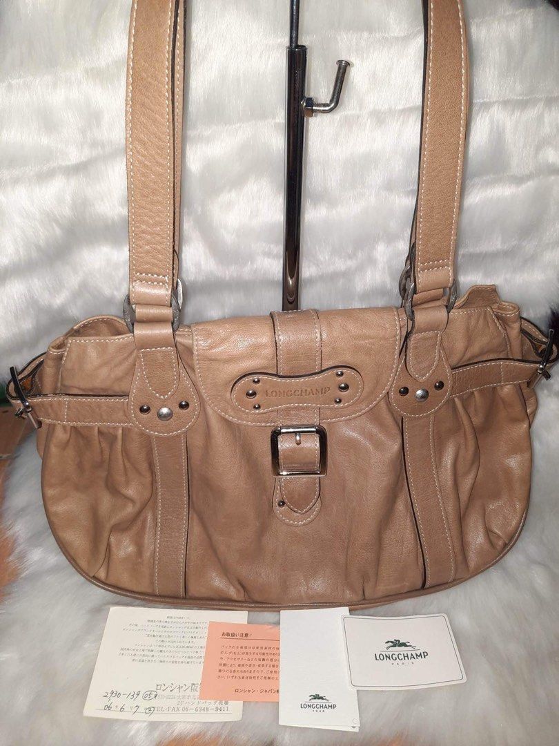 Longchamp Shoulder Bag (Category: Luxury Bags & Wallets) located in Quezon City. Submitted by lix12 (Listing ID 1229819808, Image 1). Description: ❣️💯 Authentic ❣️Cowhide leather lined with polyester ❣️Coated Fabric trimmed with calfskin ❣️Color: Beige ❣️Silver-Tone Hardware ❣️ Measurements: 36cm”L x 22.5cm”H x 14cm”W ❣️1 zippered interior compartment ❣️2 inner pockets ❣️with inner accessories strap ❣️Magnetic closure ❣️Made in France 🇫🇷 ❣️Jap