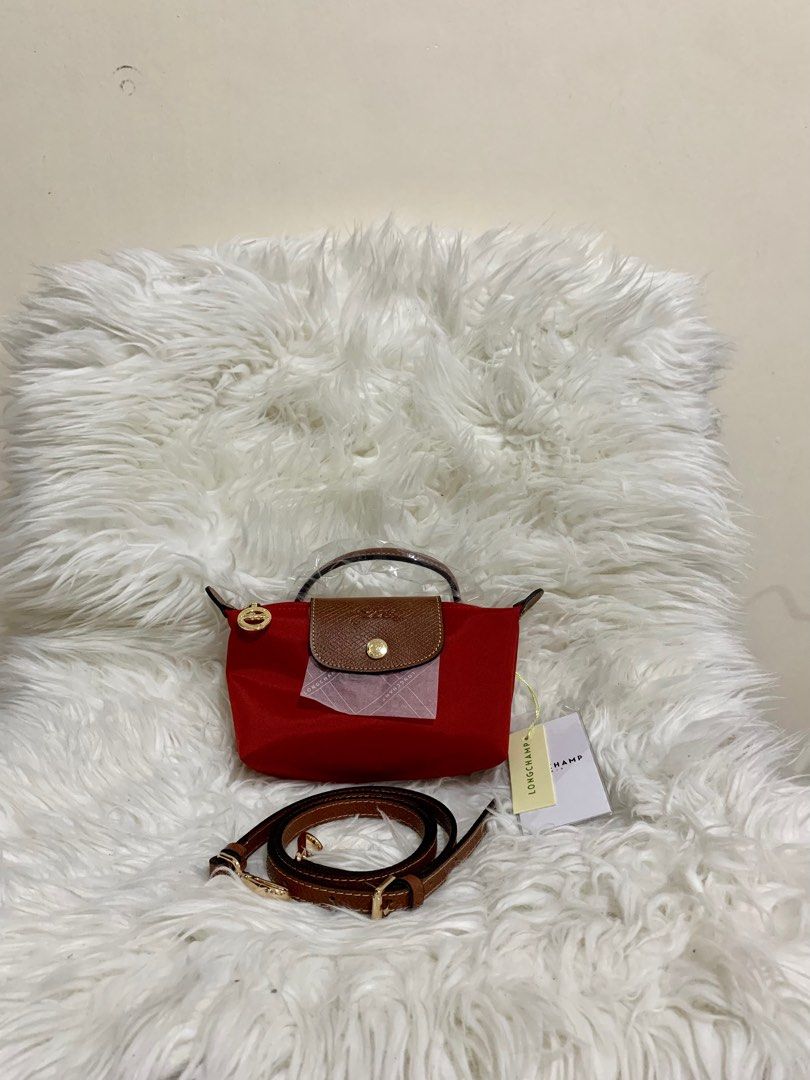 longchamp pouch mini with sling red (Category: Luxury Bags & Wallets) located in Cabuyao City. Submitted by luxbymishy (Listing ID 1232999268, Image 1). Description: brand new condition complete inclusions .