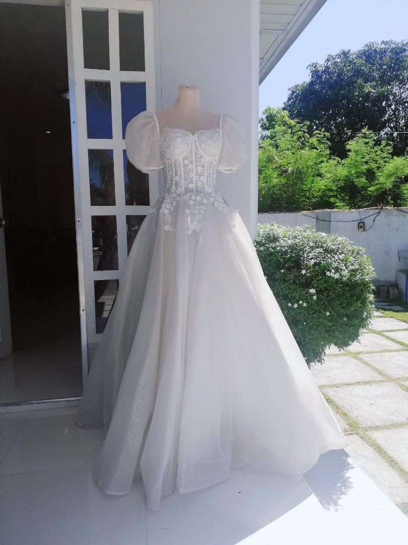 Atalier Corset wedding gown (Category: Evening dresses & gowns) located in Malolos. Submitted by sofideclutters (Listing ID 1233189377, Image 1). Description: Bought for 20K+ Selling for 15K only. Pls no more haggle!! Used by my sister on her wedding day High quality atalier wedding gown Couture wedding gown Princess like wedding gown Puffsleeves wedding gown Sheer wedding gown Small-medium frame.