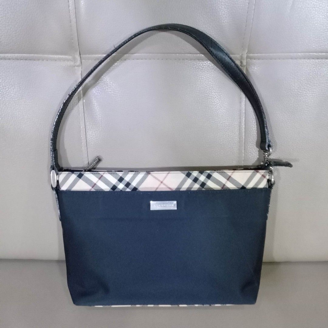 Burberry London Pochette Type Bag (Category: Luxury Bags & Wallets) located in Taguig. Submitted by esa.agustin (Listing ID 1233065759, Image 1). Description: Original Burberry London black nylon pochette type bag. Made in Japan.