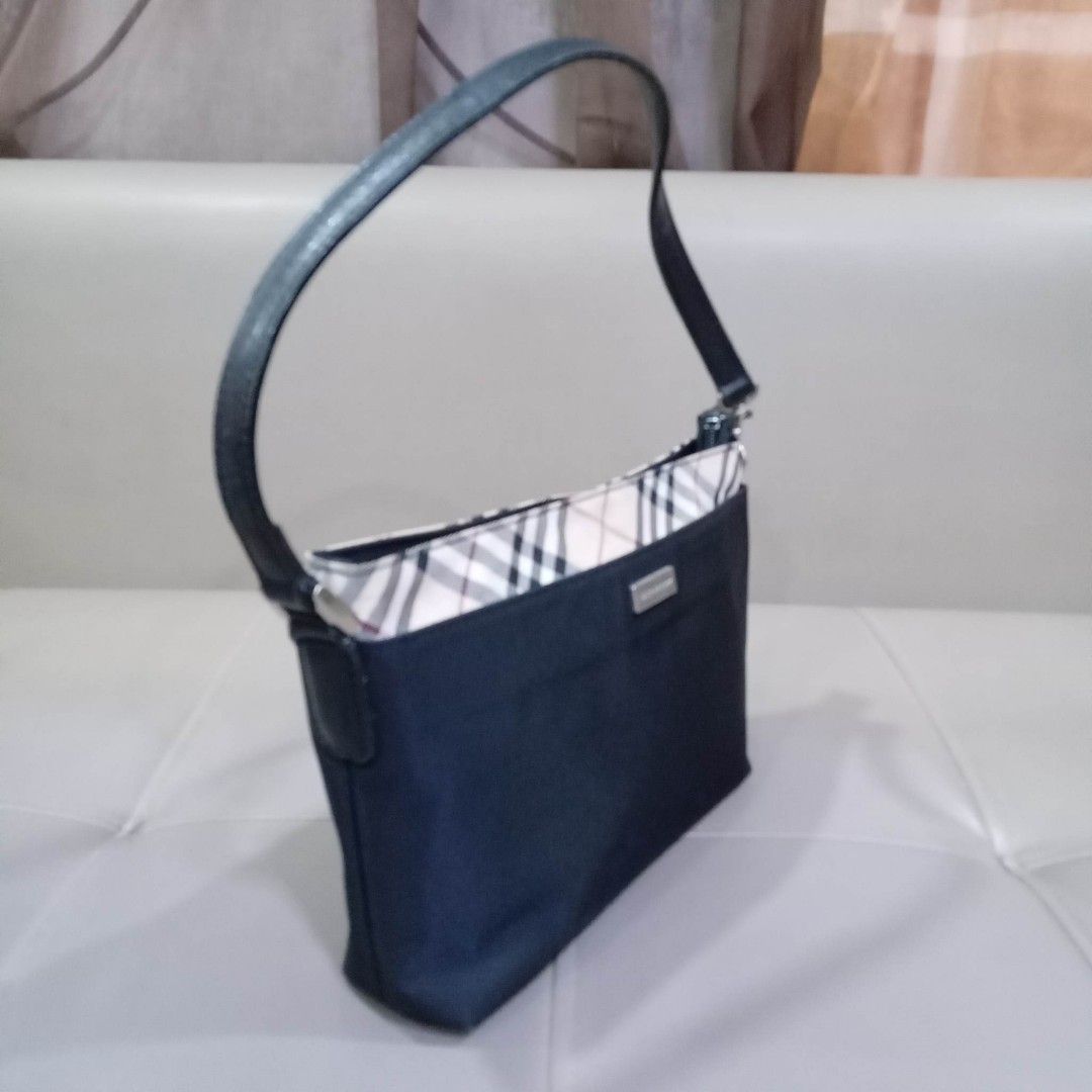 Burberry London Pochette Type Bag (Category: Luxury Bags & Wallets) located in Taguig. Submitted by esa.agustin (Listing ID 1233065759, Image 2). Description: Original Burberry London black nylon pochette type bag. Made in Japan.