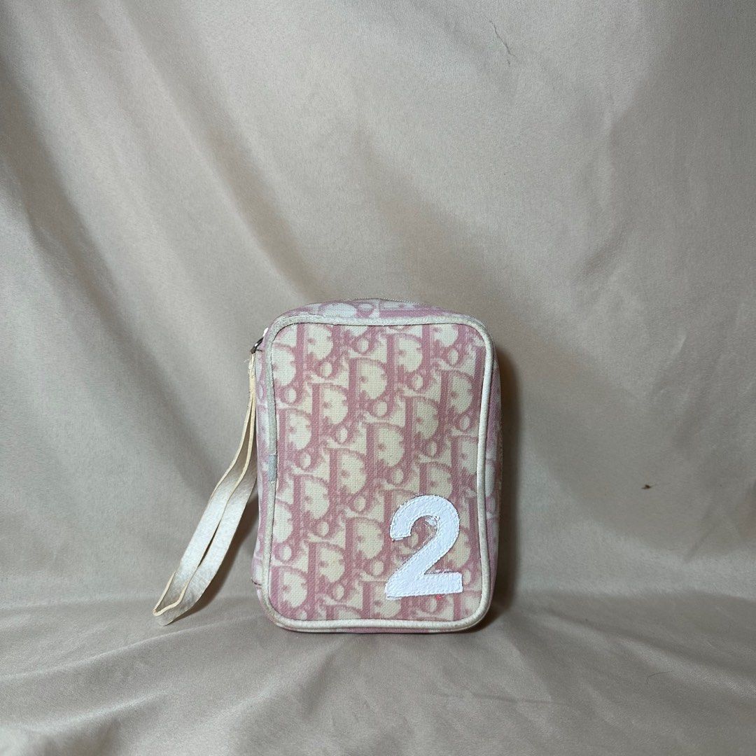 Dior pink trotter wristlet pouch (Category: Luxury Bags & Wallets) located in Baguio. Submitted by stylehouseph (Listing ID 1233147110, Image 1). Description: 🤍 Di.or Pink trotter wristlet pouch 🤍 Authentic 🤍 Rank AB 🤍 Coating of piping and number 2 & strap needs retouch ; Needs cleaning only 🤍 Valued @ $290 / ₱16k (preloved condition) 🤍 ₱ 4900 only.
