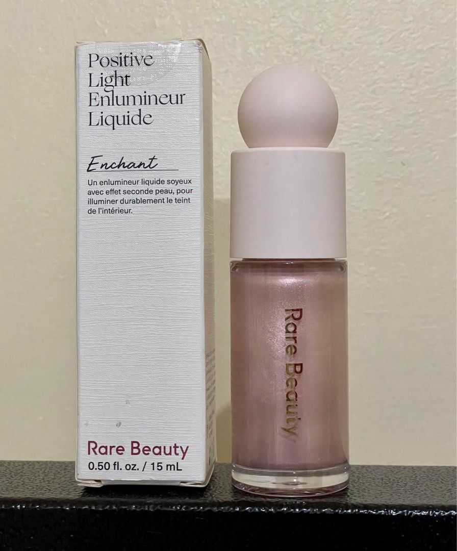 Rare Beauty Positive Light Liquid Luminizer in Enchant (Category: Makeup) located in Manila. Submitted by orangedaisies (Listing ID 1233183676, Image 1). Description: 95% full. Used 3x only. Rfs: decluttering .