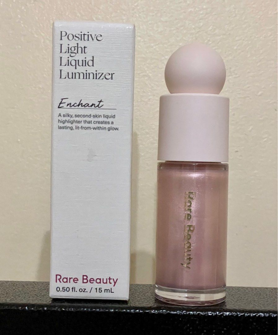 Rare Beauty Positive Light Liquid Luminizer in Enchant (Category: Makeup) located in Manila. Submitted by orangedaisies (Listing ID 1233183676, Image 2). Description: 95% full. Used 3x only. Rfs: decluttering .