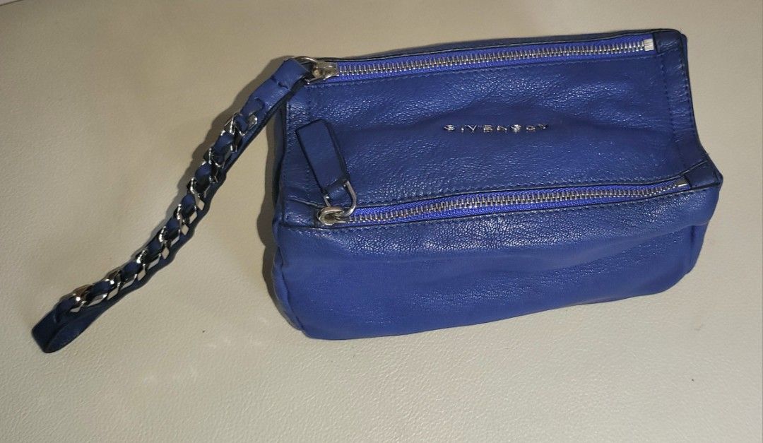 Authentic Givenchy Pandora Pouch #luxluve #luxsale (Category: Luxury Bags & Wallets) located in Quezon City. Submitted by ryrai (Listing ID 1233260135, Image 3). Description: Guaranteed Authentic Store-bought (Greenbelt 2014) Honest Flaw ● Stored leather smell ● Barely visible discoloration/darkening in some areas ● Deformed shape of bag and strap due to storage ● Minimal stains interior pocket ● Possibly in need OF BAG SPA but too lazy to do so 