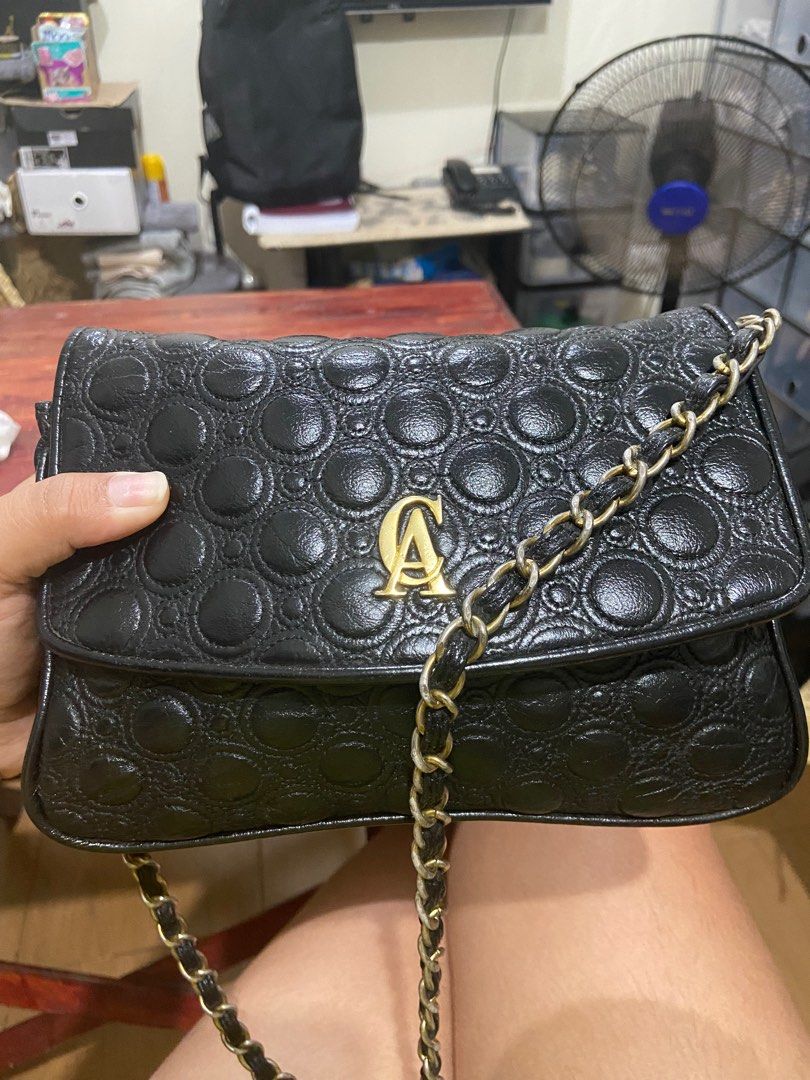 Christian Aujard Chain Sling Bag (Category: Luxury Bags & Wallets) located in Mandaluyong City. Submitted by kacianna (Listing ID 1233327340, Image 1). Description: Genuine Leather, super nice quality Still in good condition but hardware on sling a little faded, 6/10.