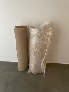 Corrugated paper roll for floor protection.