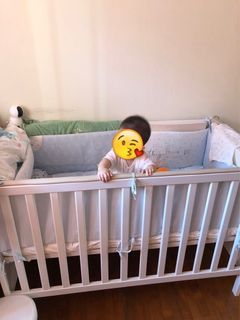IKEA cot with mattress and beddings, and a cradle