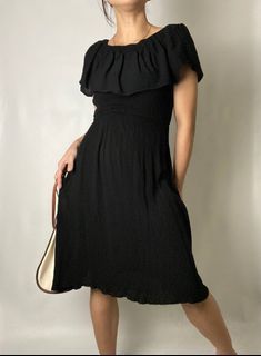 Black muslin cotton flounced collar dress.