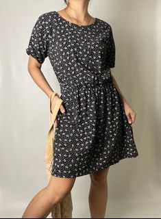 Black stretchable floral detailed mini dress with back neck self tie.