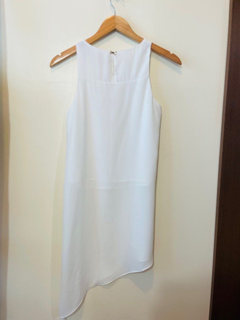 Celine white asymmetrical sleeveless top with long side slits (Category: Sleeveless) located in Pasig City. Submitted by kendalldf (Listing ID 1233494843, Image 3). Description: .