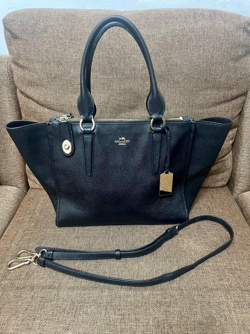 COACH Carry all bag (Category: Luxury Bags & Wallets) located in San Pablo. Submitted by prelovedbymistyblue (Listing ID 1233431763, Image 1). Description: Authentic Coach 2-way carry all bag. May be used as handbag or shoulder/sling bag. Still in very good condition . Flaw: minor rubber lining issue onnthe handle and some fading on the hardware on sling slot. made in the Philippines. Selling low for 4500, down to 4000, then 3700, 3200 then 3000.