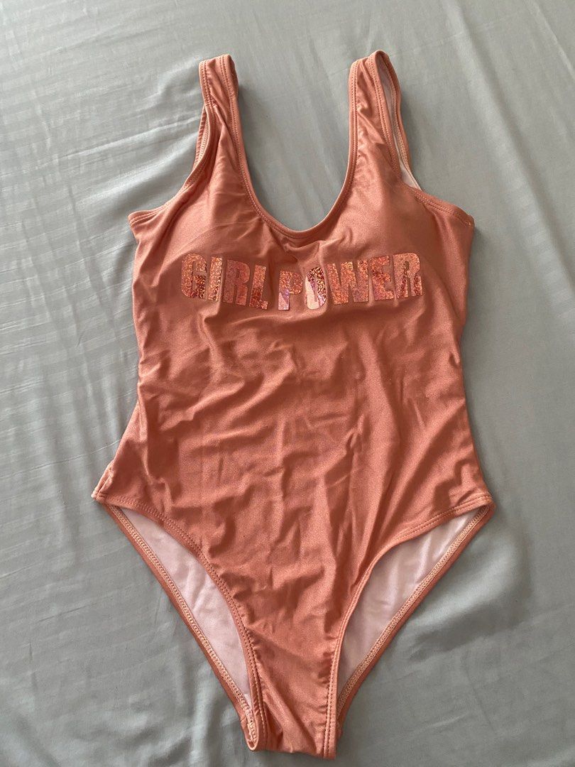 Padded rose gold metallic swimsuit (Category: Bikinis & Swimsuits) located in Quezon City. Submitted by cam000 (Listing ID 1233399089, Image 1). Description: Has flaws in the bum area. Please see picture. Fits medium.