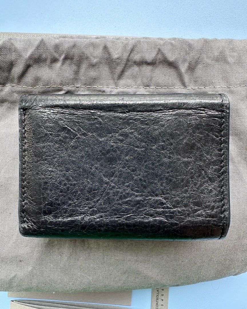 Authentic Balenciaga Compact Wallet (Category: Luxury Bags & Wallets) located in Pasig City. Submitted by kitsch_closet (Listing ID 1233617174, Image 3). Description: Authentic Balenciaga Compact Wallet *Black distressed Leather, Silver hardware. *hard to find style *Inclusions: original dustbag, box, cards *Rank: AB- B *With signs of usage, hairline scratches, ✨️Php 12k only.