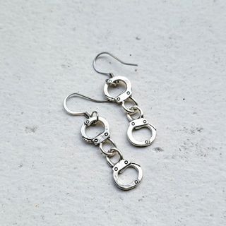 Dangling top handcuff earrings