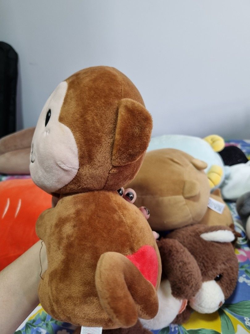 monkey! (Category: Plushies & Soft Toys) located in Singapore. Submitted by silentnighta (Listing ID 1233649611, Image 3). Description: miniso monkey plush! it has a heart for an ass HAHA 23cm x 17cm x 10cm.