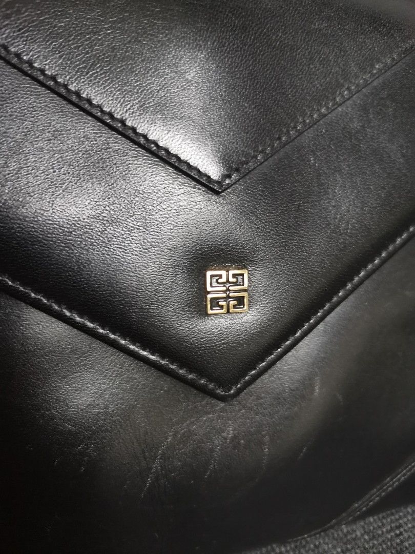RUSH! Givenchy Sac black Shoulder sling bag (Category: Luxury Bags & Wallets) located in Angeles City. Submitted by thriftedbrandsfinder (Listing ID 1233739829, Image 3). Description: ‼️RUSH SALE!!! Guaranteed Authentic Givenchy Sac black Shoulder sling bag -well used condition: Exterior in excellent condition, normal hairlines on black smooth leather -flaw on the interior flap - recolored but paint not so good, sticky and peeled Overall still a 