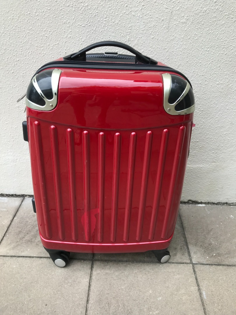 Maroon 22 inches expandable 8wheeler spinner cabin luggage. In good