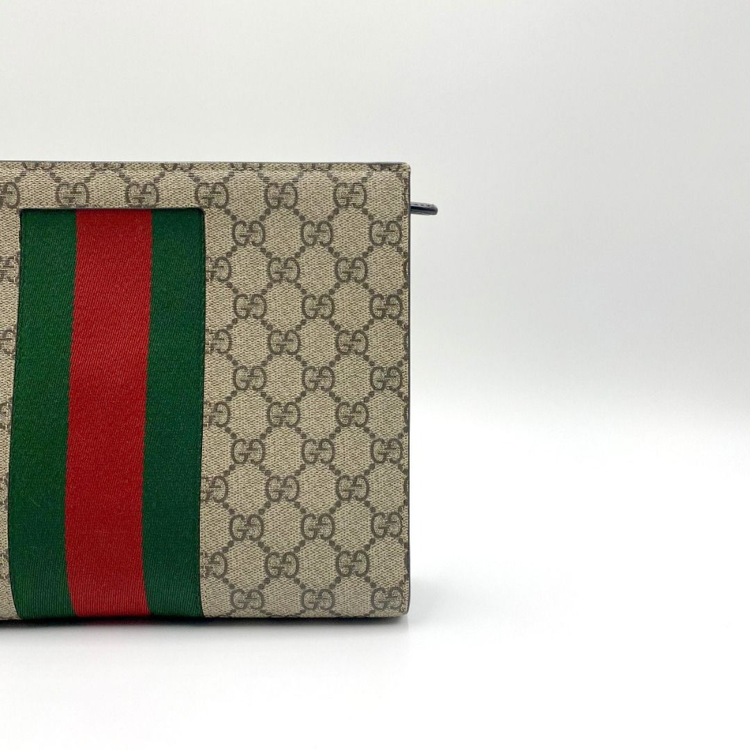 Gucci supreme web pouch best sale