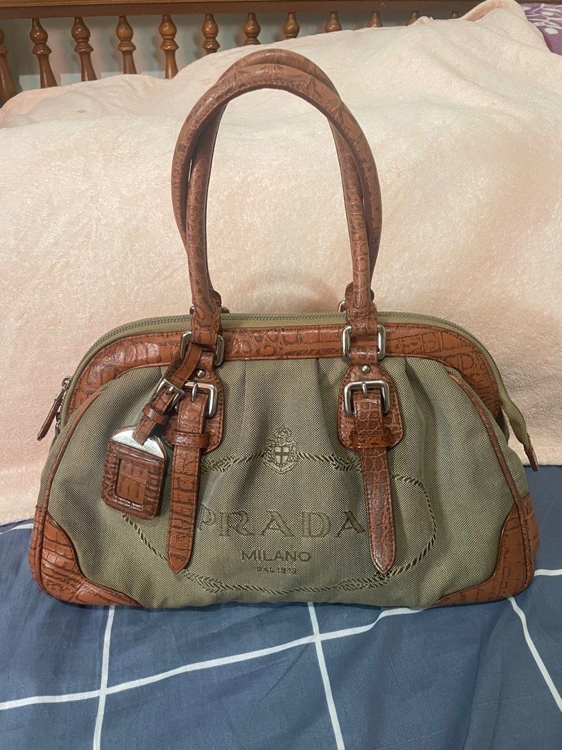 PRADA jacquard doctor’s bag (Category: Luxury Bags & Wallets) located in San Pablo. Submitted by prelovedbymistyblue (Listing ID 1233733886, Image 1). Description: Super nice prada doctors bag. The bag has discoloration on the canvass. It is very spacious. It is also made of croc skin on the lining . Still very nice. The hardwares has prada in it. Measures 14 x 8.5 x 5 inches. Selling low for 3000, down to 2700, 2300, then 2000.