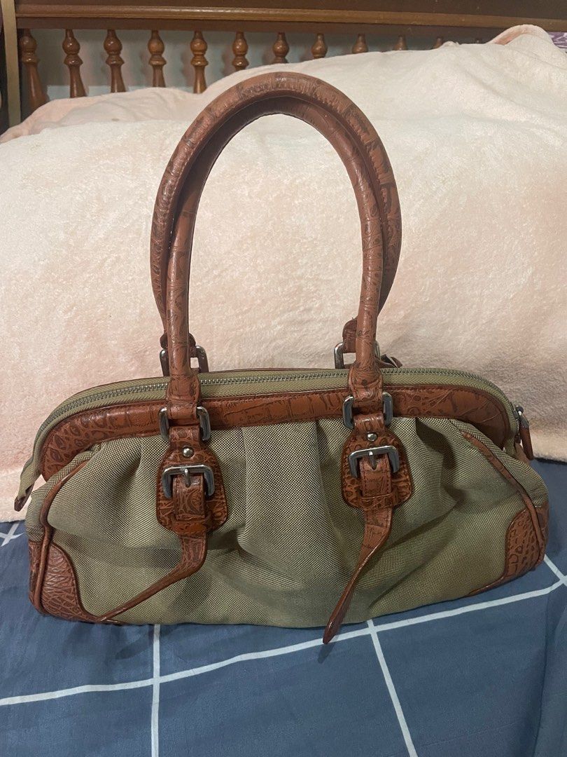 PRADA jacquard doctor’s bag (Category: Luxury Bags & Wallets) located in San Pablo. Submitted by prelovedbymistyblue (Listing ID 1233733886, Image 2). Description: Super nice prada doctors bag. The bag has discoloration on the canvass. It is very spacious. It is also made of croc skin on the lining . Still very nice. The hardwares has prada in it. Measures 14 x 8.5 x 5 inches. Selling low for 3000, down to 2700, 2300, then 2000.