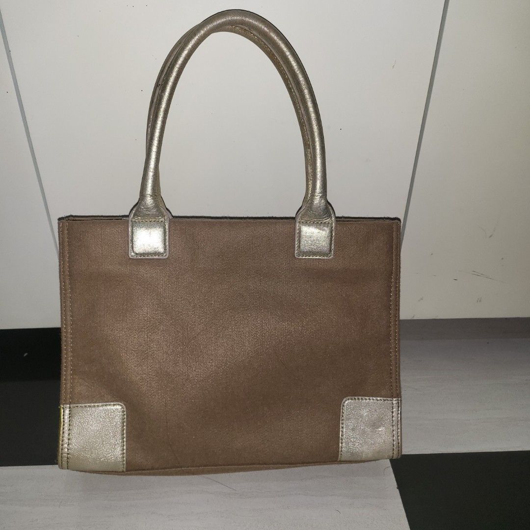 Preloved Tory Burch Ella tote Gold (Category: Luxury Bags & Wallets) located in Bulacan. Submitted by comkay (Listing ID 1233732517, Image 2). Description: Needs cleaning Selling it low need to delcutter * Issue on the rubber lining * Need cleaning MOP: Gcash BDO BPI courier: LBC J&T.