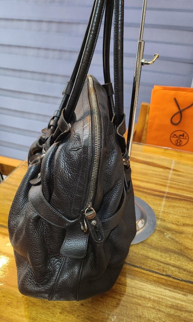 Salvatore Ferragamo Leather Handbag (Category: Luxury Bags & Wallets) located in Daet. Submitted by BagMom (Listing ID 1233793459, Image 3). Description: Salvatore Ferragamo Leather Handbag Good Condition With card and dust bag Swipe for detailed pics 👉cash or installment 👉PM or viber (09189599588) for details Disclaimer: BagMom is not associated with the brand featured.All copyrights reserved to the original brand holders..