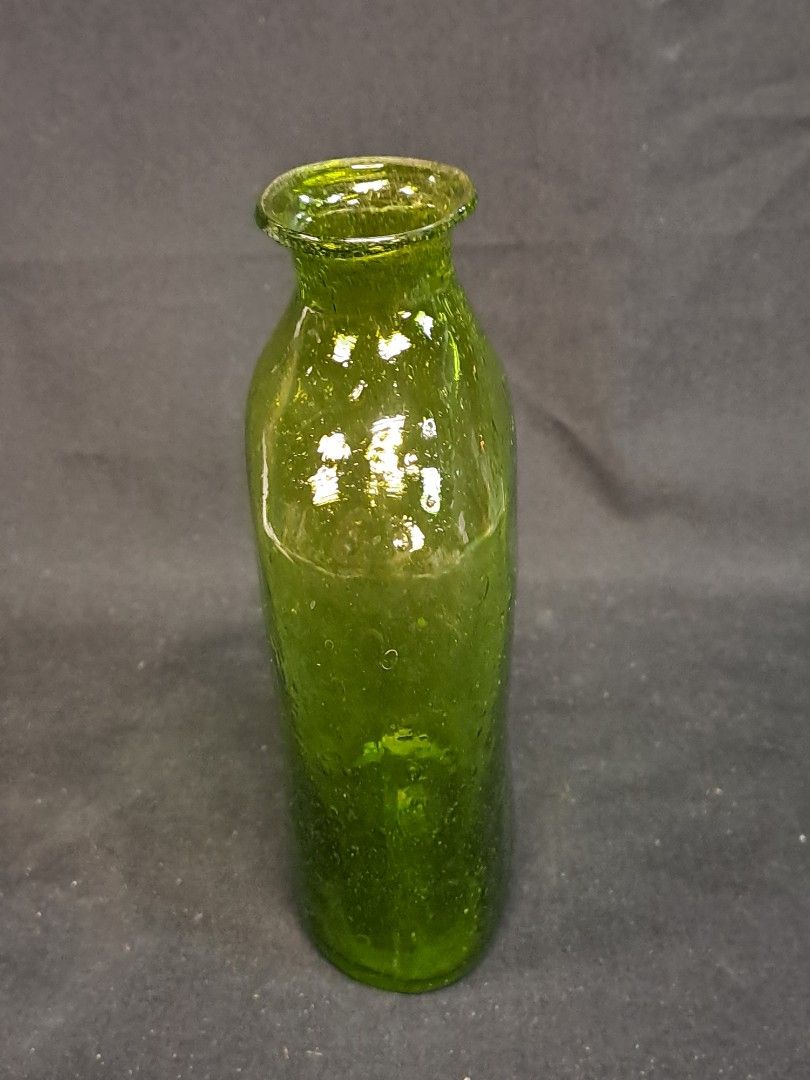 Antique hand blown Olive Green glass bottle The bottle style is a flask with a hand flared