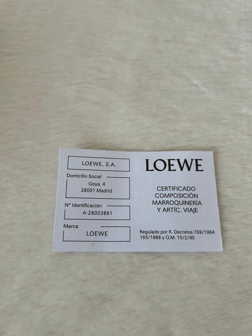 Loewe Leather Anagram Coin Cardholder (Category: Luxury Bags & Wallets) located in Manila. Submitted by bagislifeshop (Listing ID 1233948901, Image 2). Description: ▪️Loewe Leather Anagram Coin Cardholder▪️ ☑️Available in Pampanga ✅Condition: 8.8/10 ✅Color: Light oat and brown in PHW ✅Material: Calf leather ✅Inclusions: Dust bag, box, booklet and cards .