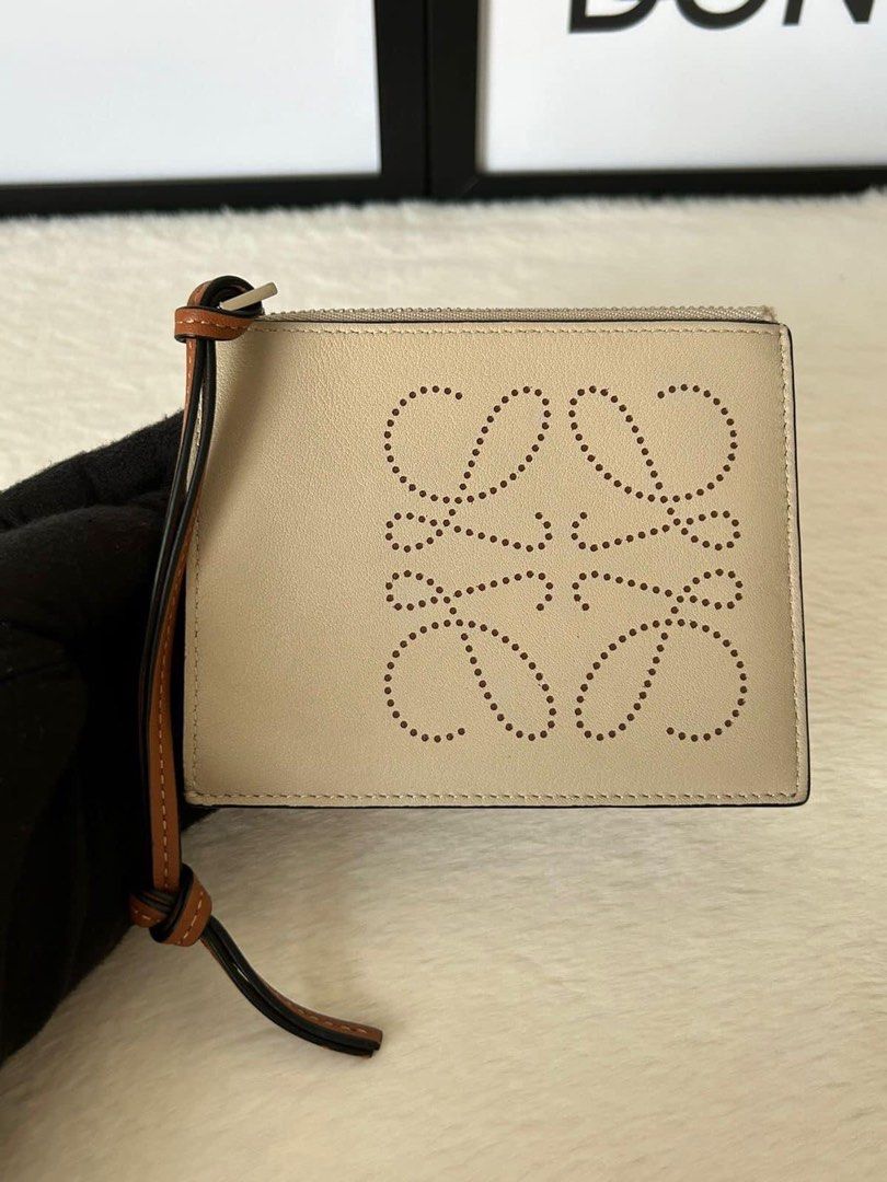 Loewe Leather Anagram Coin Cardholder (Category: Luxury Bags & Wallets) located in Manila. Submitted by bagislifeshop (Listing ID 1233948901, Image 3). Description: ▪️Loewe Leather Anagram Coin Cardholder▪️ ☑️Available in Pampanga ✅Condition: 8.8/10 ✅Color: Light oat and brown in PHW ✅Material: Calf leather ✅Inclusions: Dust bag, box, booklet and cards .