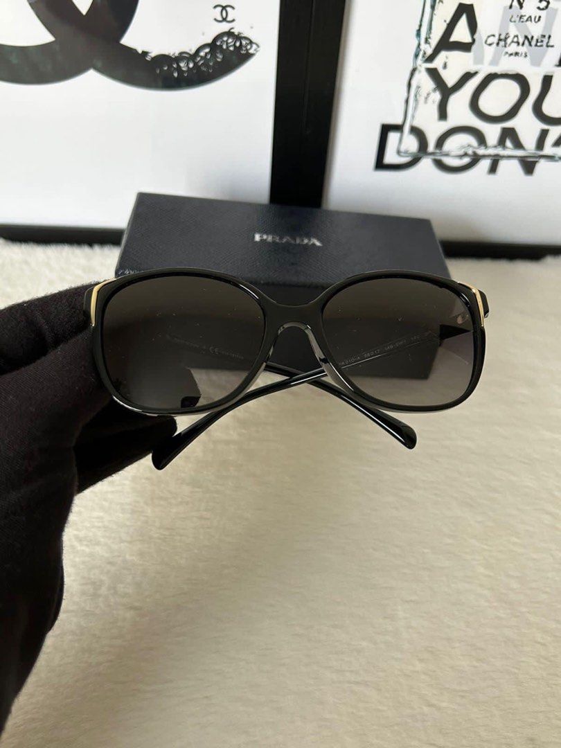 Prada Black Gold Sunglasses (Category: Sunglasses & Eyewear) located in Manila. Submitted by bagislifeshop (Listing ID 1233950082, Image 2). Description: ▪️Prada Black Gold Sunglasses▪️ ☑️Available in Pampanga ✅Condition: 8.8/10 ✅Lens material: Cr39 ✅Lens Technology: Gradient ✅Lens color: Polar Gray Gradient ✅LENS: 55MM, TEMPLE: 140MM & BRIDGE: 17MM ✅Inclusion: Case and box .
