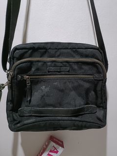 Tumi authentic 4 zip compartment  comouflage sling bag