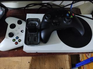 Xbox series s with box and two controllers with 2 rechargeable batteries  and 25k plus worth of games