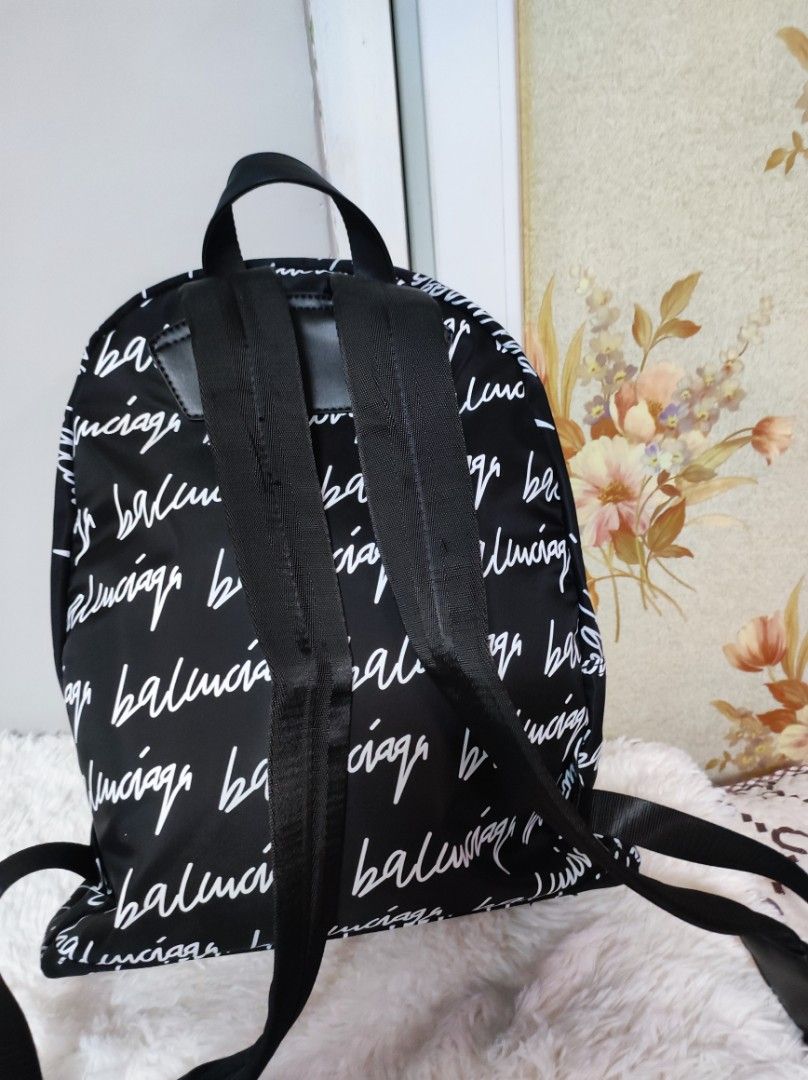 🎒 Blk and White BP (Category: Luxury Bags & Wallets) located in Santa Rosa. Submitted by yerbua103 (Listing ID 1234189360, Image 3). Description: 🎒This functional balenciaga backpack features white print front and back with adjustable black straps and a small top handle. zip closure, print on big font at the top. the interior and exterior is clean. the bag is in mint condition, 9.5/10. 🎒 authenticity of the bag is not guaranteed. 🎒manage your