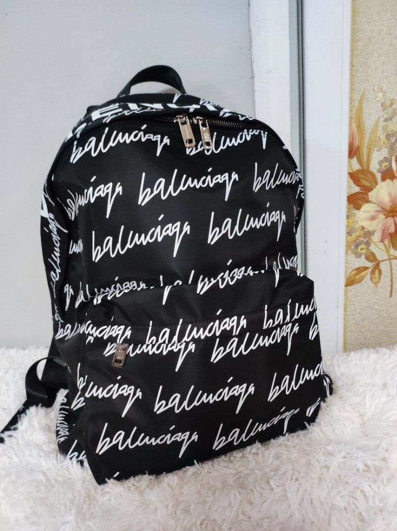 🎒 Blk and White BP (Category: Luxury Bags & Wallets) located in Santa Rosa. Submitted by yerbua103 (Listing ID 1234189360, Image 1). Description: 🎒This functional balenciaga backpack features white print front and back with adjustable black straps and a small top handle. zip closure, print on big font at the top. the interior and exterior is clean. the bag is in mint condition, 9.5/10. 🎒 authenticity of the bag is not guaranteed. 🎒manage your
