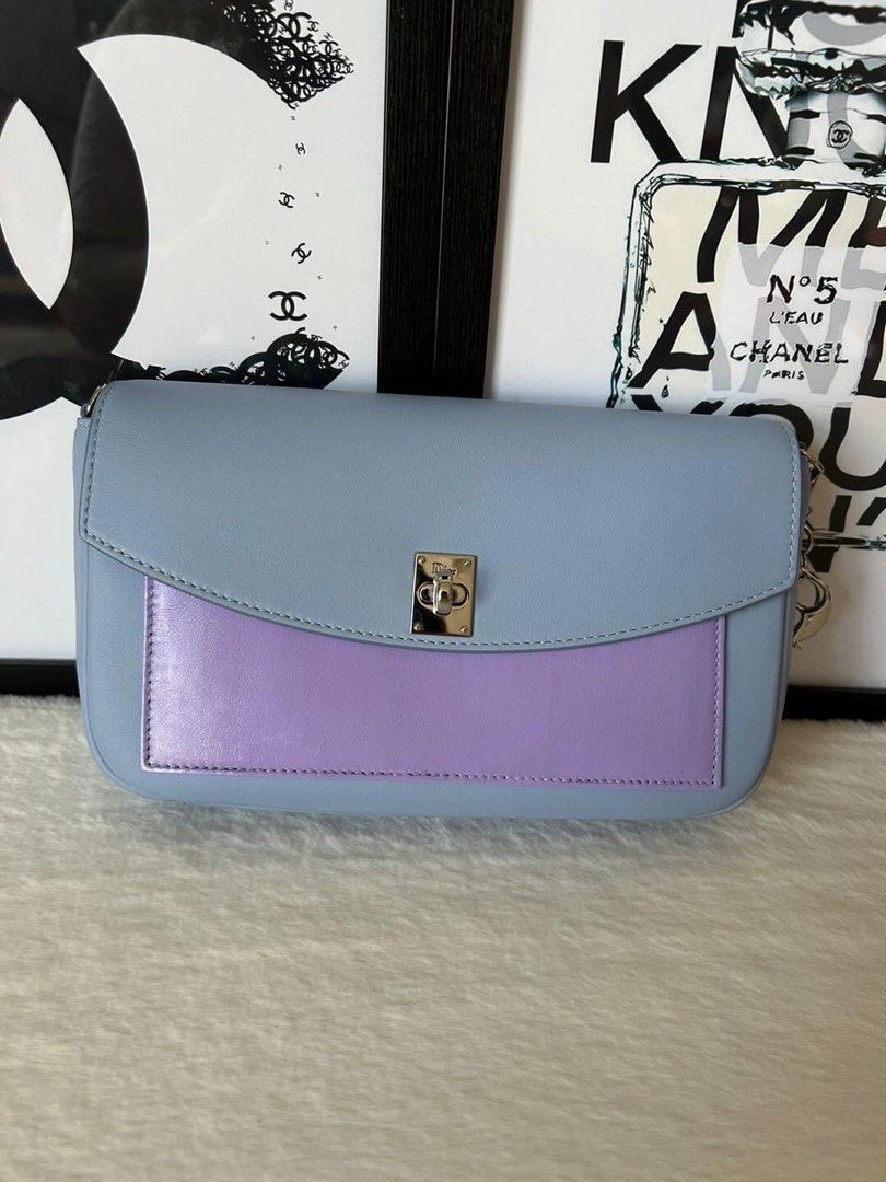 Christian Dior Turnlock WOC Bag (Category: Luxury Bags & Wallets) located in Manila. Submitted by bagislifeshop (Listing ID 1234066837, Image 2). Description: ▪️Christian Dior Turnlock WOC Bag▪️ ☑️Available in Pampanga ✅Condition: 8.8/10 ✅Material: Calf leather ✅Colour: Blue/ Lilac in SHW ✅Size: 8.5”W x 5”H x 2”D, 23” strap drop ✅Inclusions: Dustbag, chain, card, charm and box .