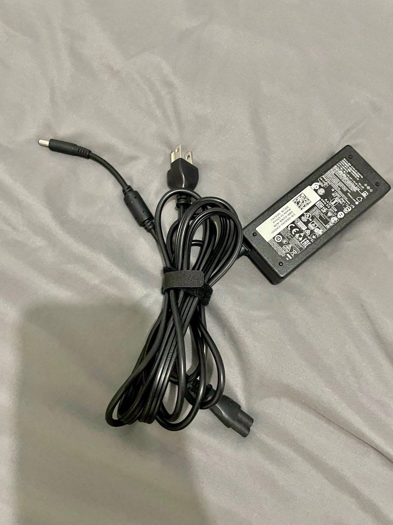 Dell 65w laptop charger Original (Category: Chargers) located in Taguig. Submitted by chellyx (Listing ID 1234088735, Image 3). Description: For sale Dell 65w original laptop charger Lightly used. Looks brand new. This charger is original. Came with the laptop RFS: spare. Not in use. Laptop was disposed already. Fixed price 700. No meetup. Deliver only.