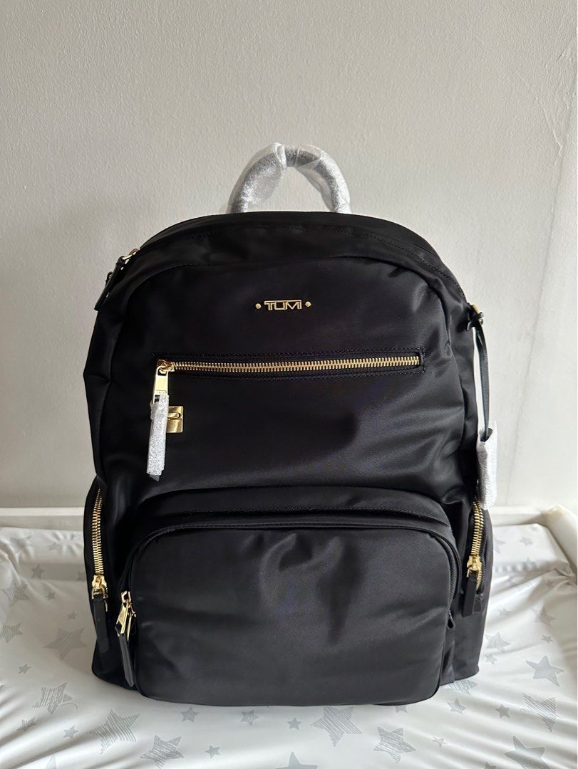 Black backpack sales with gold zippers