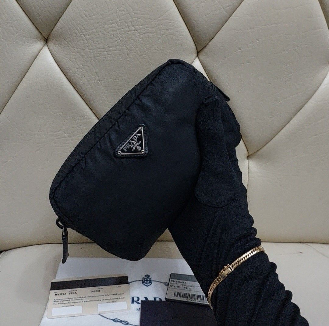 Authentic Prada Pouch MV176 Vela Nero (Category: Luxury Bags & Wallets) located in Binangonan. Submitted by makoleksyon (Listing ID 1234371713, Image 2). Description: excellent condition no flaws bought in Japan complete with cards and dust bag 💯% Authentic Money back guarantee.