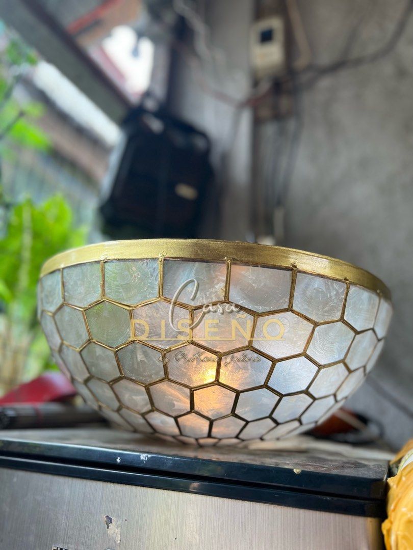 Capiz ceiling lamp (Category: Lighting) located in Caloocan City. Submitted by casadisenyo (Listing ID 1234401640, Image 1). Description: MADE TO ORDER CAPIZ CEILING LAMP Size: 16.5" Lead time: 10-15days after downpayment confirmation We co customized other capiz designs.