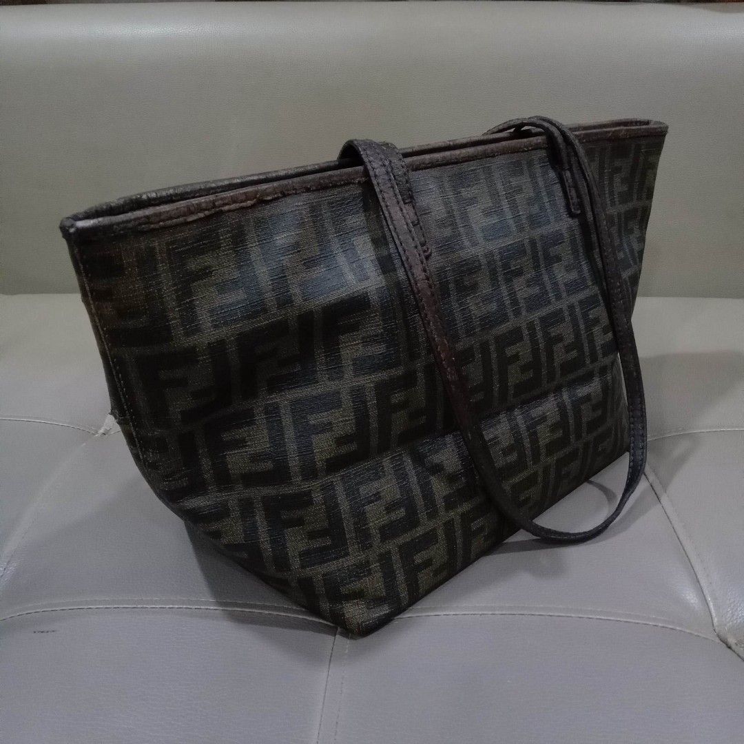Fendi Monogram Tote Bag (Category: Luxury Bags & Wallets) located in Taguig. Submitted by esa.agustin (Listing ID 1234294962, Image 2). Description: Original Fendi monogram small tote bag. Flaws on the strap and top piping of the bag and a hole in one side. With authenticity card. Made in Italy..