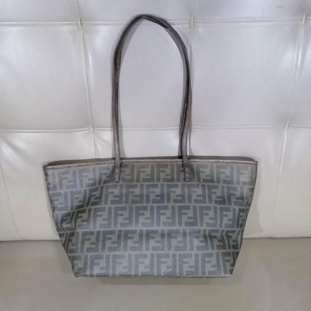 Fendi Monogram Tote Bag (Category: Luxury Bags & Wallets) located in Taguig. Submitted by esa.agustin (Listing ID 1234294962, Image 1). Description: Original Fendi monogram small tote bag. Flaws on the strap and top piping of the bag and a hole in one side. With authenticity card. Made in Italy..