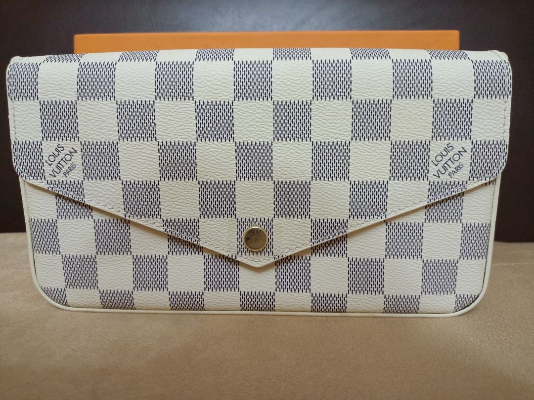LV Felicie Sling Wallet (Category: Luxury Bags & Wallets) located in Amadeo. Submitted by lovedbyleslee (Listing ID 1234339476, Image 3). Description: BRAND NEW LV Felicie Sling Wallet Color: White Azure with FREE LV Cles Coin Purse ☺️ Reason for Selling: Decluttering, bought this for Php 2799.