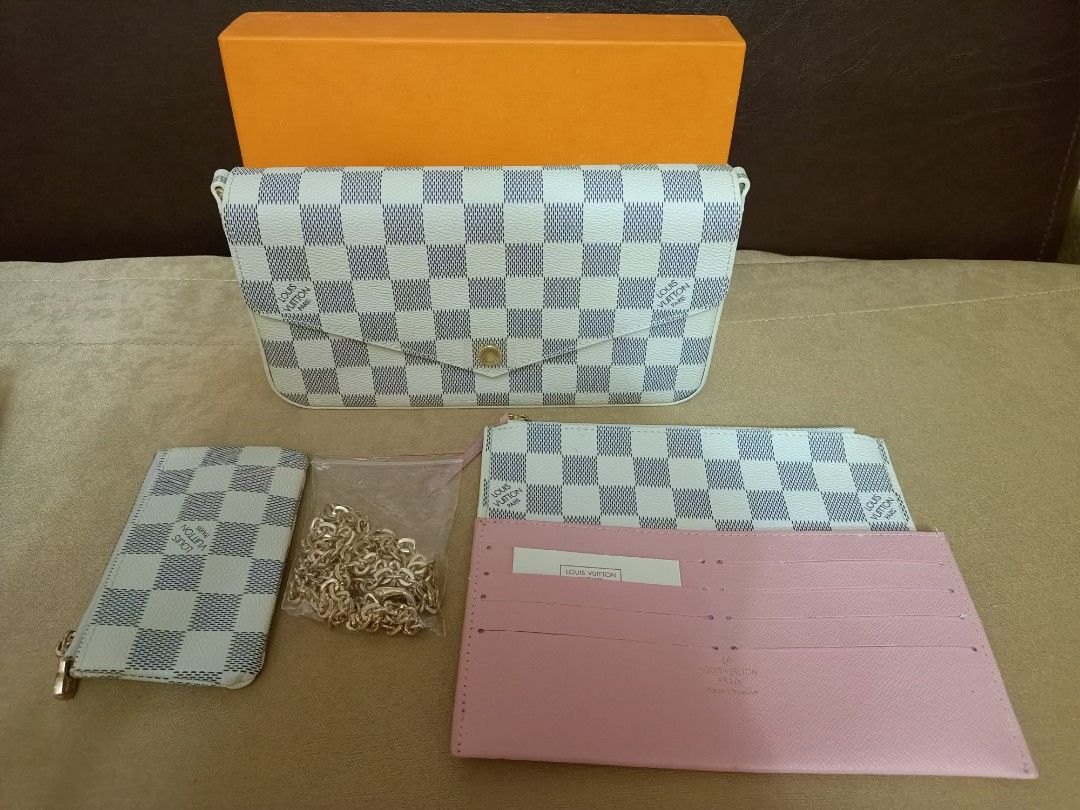 LV Felicie Sling Wallet (Category: Luxury Bags & Wallets) located in Amadeo. Submitted by lovedbyleslee (Listing ID 1234339476, Image 1). Description: BRAND NEW LV Felicie Sling Wallet Color: White Azure with FREE LV Cles Coin Purse ☺️ Reason for Selling: Decluttering, bought this for Php 2799.