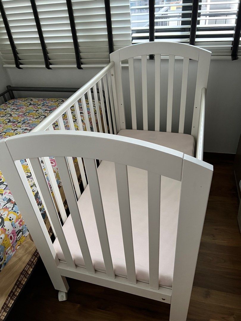 Ashworth drop side cot shop