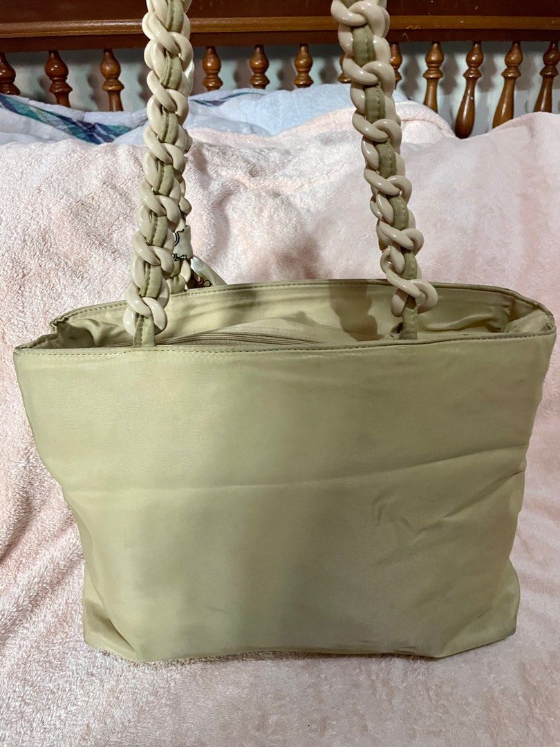 PRADA vintage tessuto shoulder bag (Category: Luxury Bags & Wallets) located in San Pablo. Submitted by prelovedbymistyblue (Listing ID 1234323884, Image 2). Description: Vintage PRADA tessuto bag with plastic chain. No major flaws except for a missing chain on the handle hence twilly was provided. No rubs on the corners just minimal dirt. The inner lining is quite thick. It has 1 inner pocket. Selling low for 3200. Measures 11 x 9 x 3.8 inches..