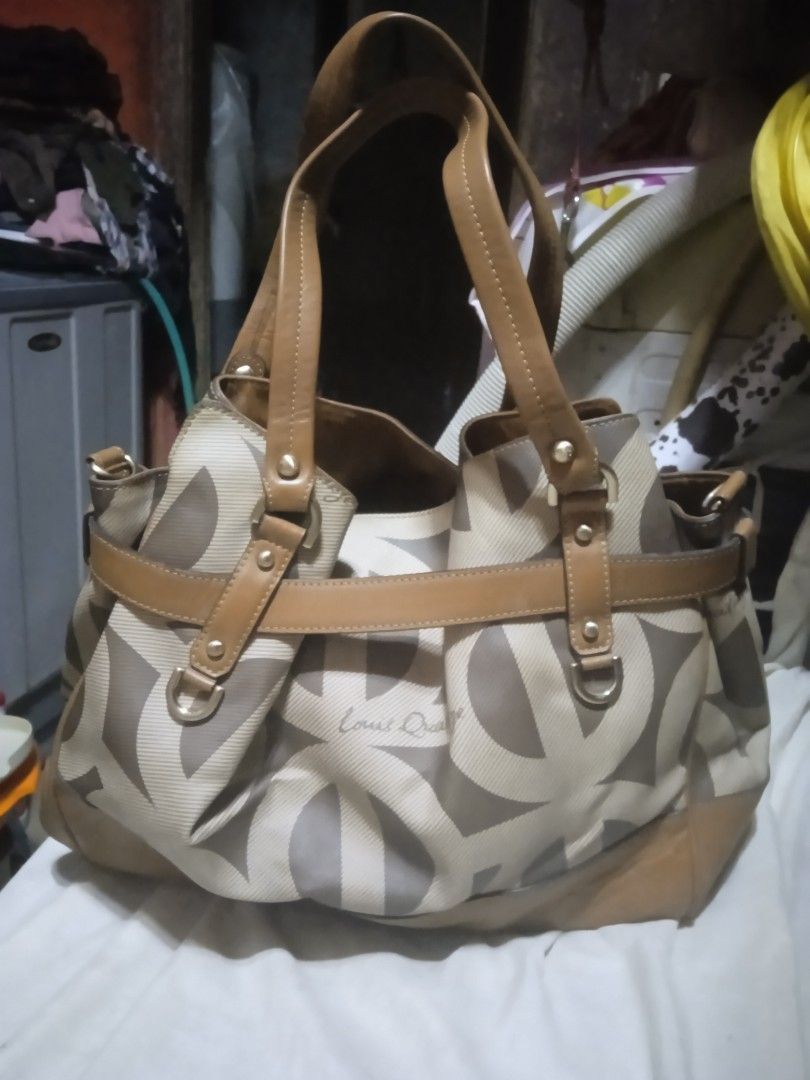 Preloved Original Louis Quatorze Bag (Category: Luxury Bags & Wallets) located in Mandaluyong City. Submitted by vinciel_545 (Listing ID 1234344834, Image 2). Description: Authentic Louis Quatorze Bag large size.Genuine leather and canvass materials. no sling included .No major flaws .Snap not so magnetic. Price Negotiable for sure buyer only .