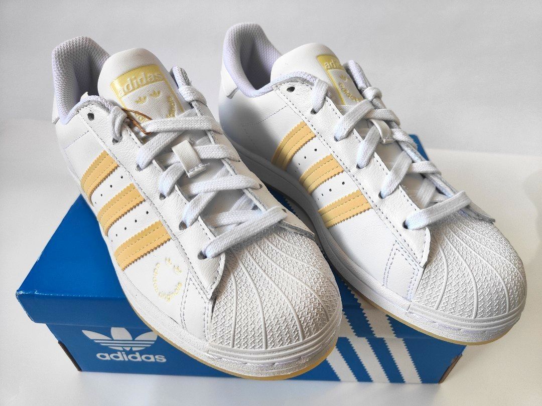 White and cheap yellow adidas superstar