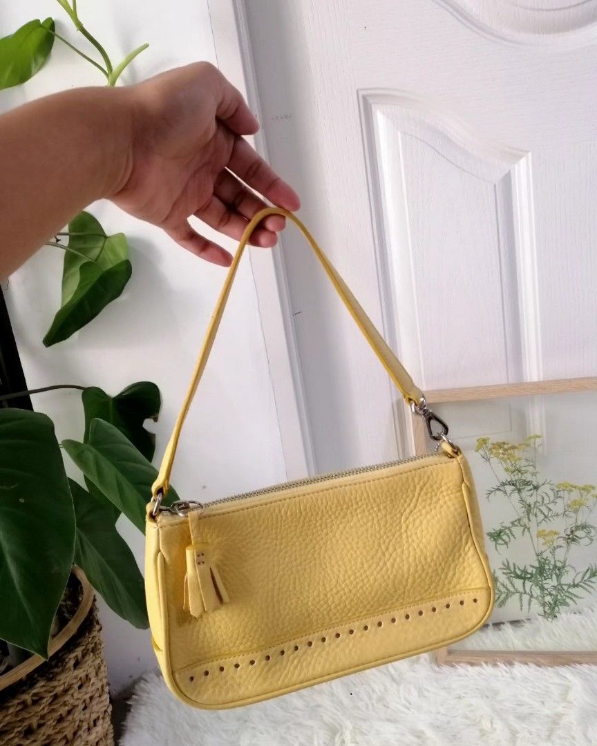💯Authentic Coach Kili bag in yellow (Category: Luxury Bags & Wallets) located in Malolos. Submitted by sofideclutters (Listing ID 1227735758, Image 1). Description: SALE❗FIXED PRICE GUARANTEED ORIG COACH KILI BAG RARE / COACH NEWYORK, guaranteed pinakamatibay na gawa Personal Preowned Bought in Japan No flaws, na-stock lang talaga..